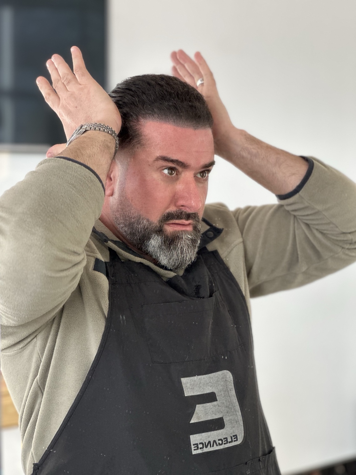 Barber styled hair with low fade