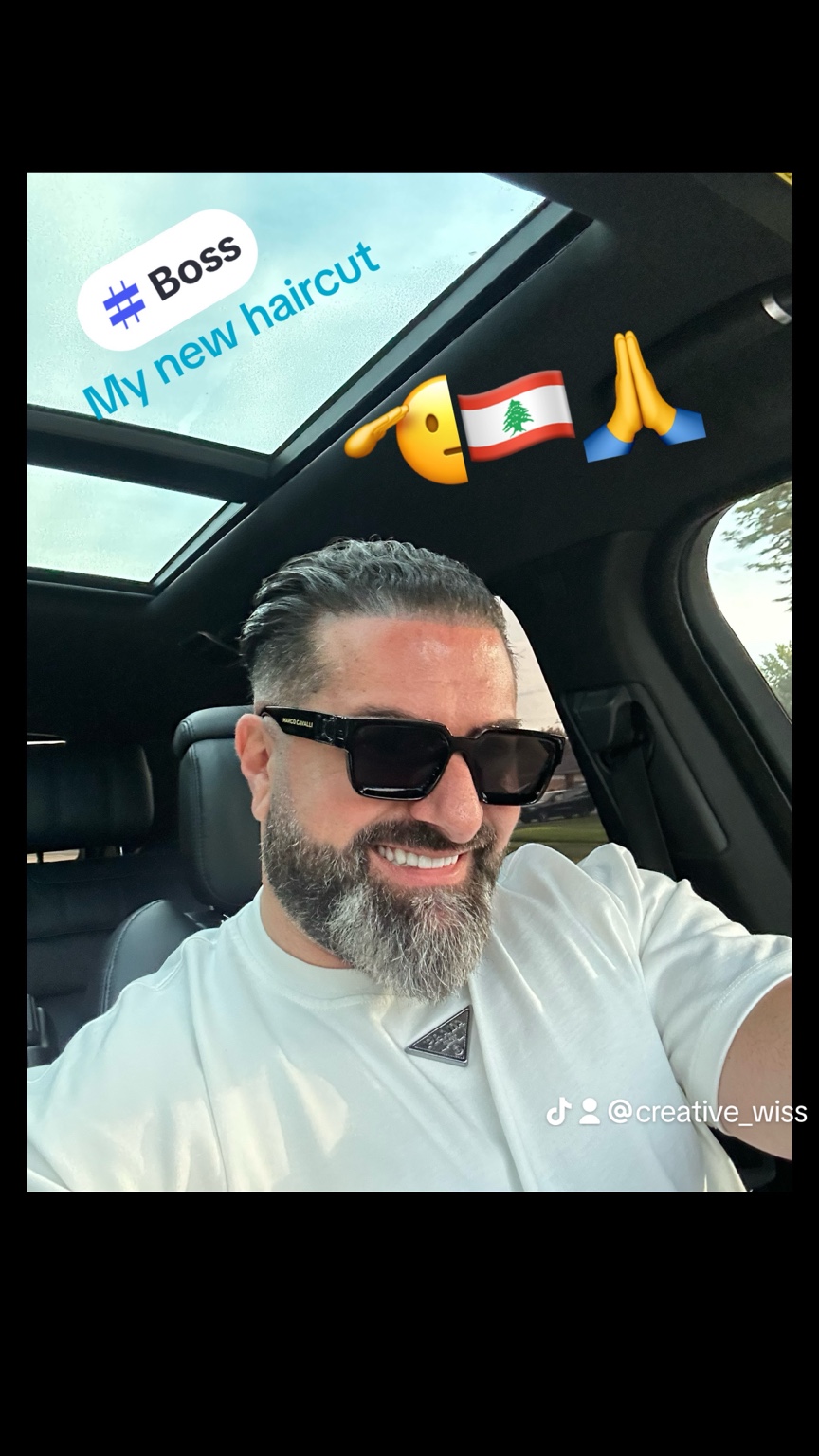 Adult slick back with low fade in car shot